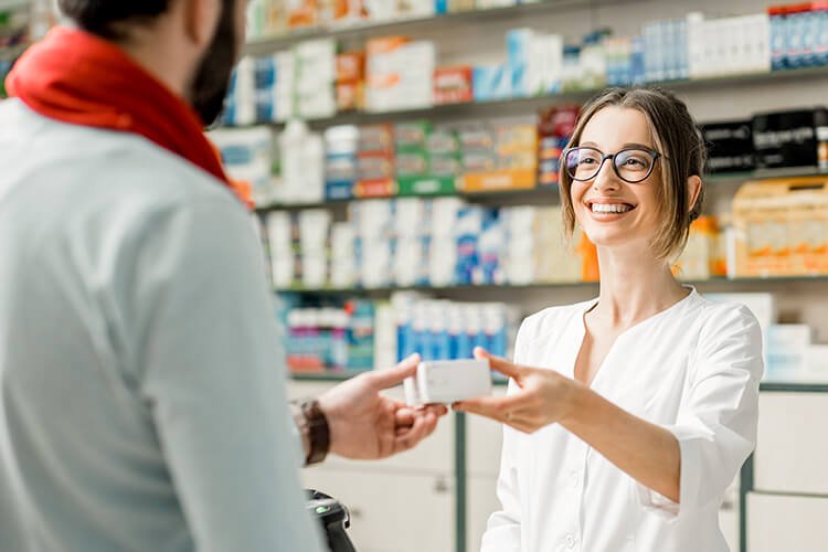 people buying medication at local pharmacy