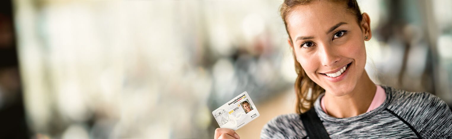 woman holding her electronic health insurance card