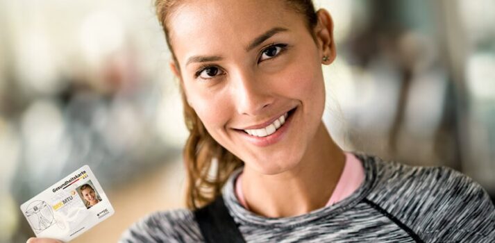 woman holding her electronic health insurance card