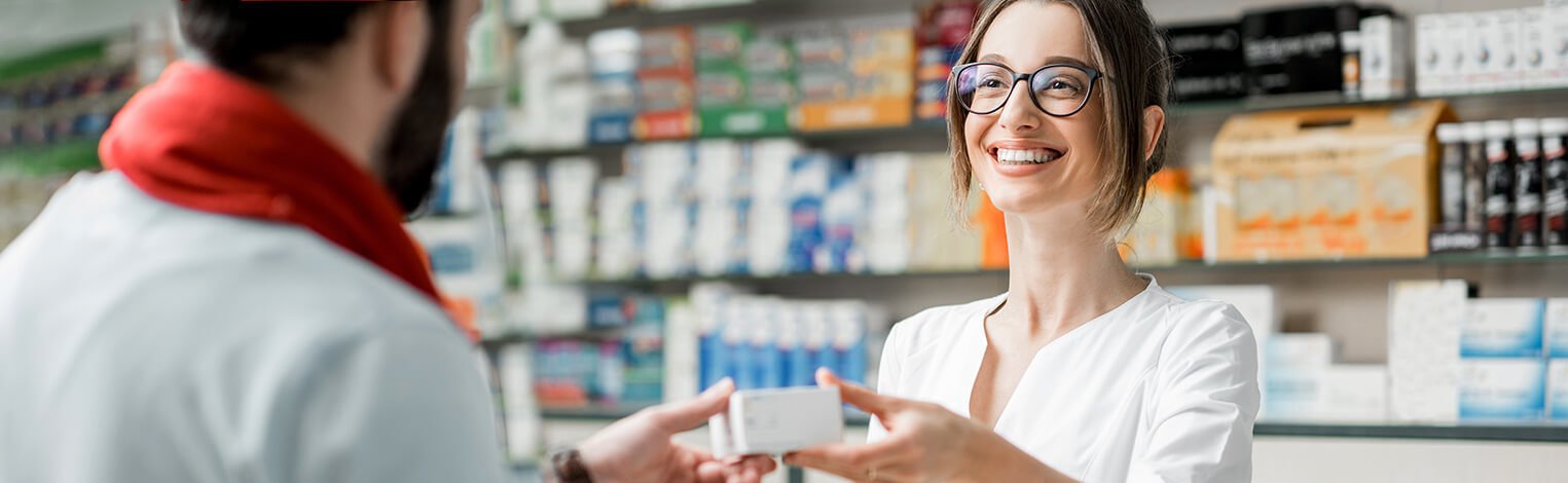 people buying medication at local pharmacy